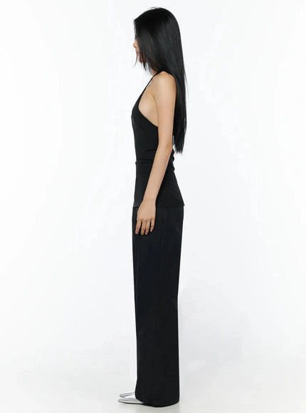 Cotton Pocket Bootcut Pants IL516 Black side view full length on model, wide bootcut silhouette, black halter top, silver pointed-toe heels