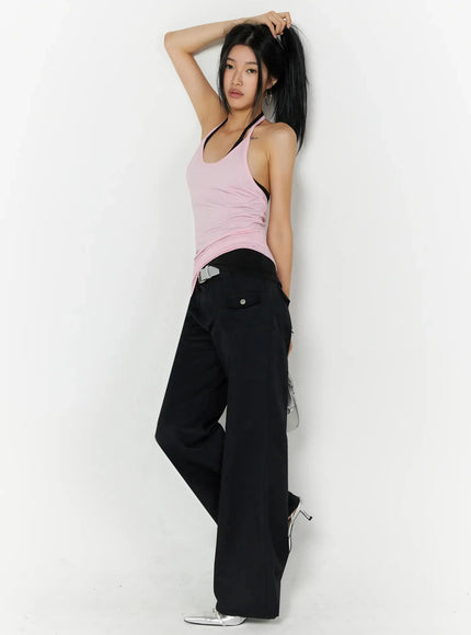 Cotton Pocket Bootcut Pants IL516 Black side view on model, dynamic pose arm raised, styled with pink halter tank and silver belt, full length