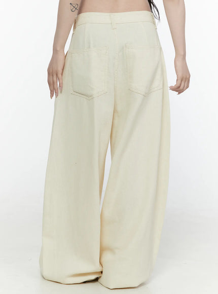 Cotton Wide Leg Pants IL521 Light beige back view on model showing two back patch pockets with stitching detail and ultra-wide tapered leg hem