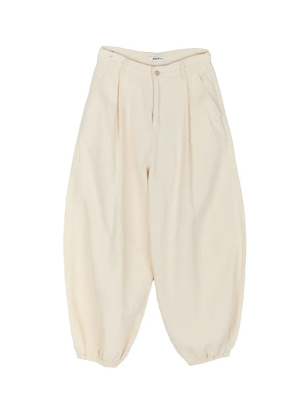 Cotton Wide Leg Pants IL521 Light beige flat-lay showing full balloon wide-leg silhouette, pleated front, silver button, elastic ankle cuffs, and brand label