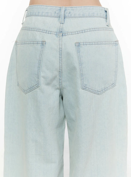 Cove Washed Wide Leg Jeans CL521 Light blue back close-up on model showing two rear patch pockets, waistband, belt loops, and washed denim texture