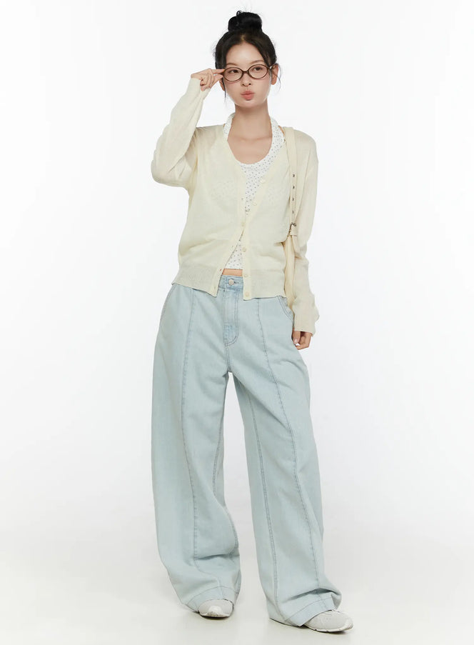Cove Washed Wide Leg Jeans CL521 Light blue full-length front view on model styled with cream cardigan, white lace top, glasses, and white sneakers