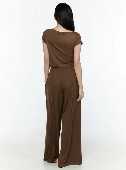 Cowl Neck Top and Loose-Fit Pants Set IL506 Brown back shot model standing upright full length back view smooth top wide-leg pleated pants sandals