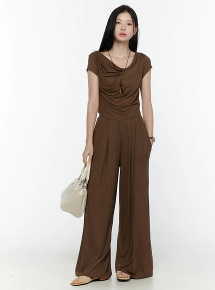 LEWKIN Cowl Neck Top and Loose-Fit Pants Set IL506 Brown S/M front shot model standing holding cream bag wearing sandals draped jersey two-piece