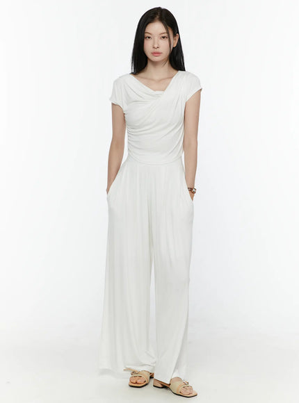 Cowl Neck Top and Loose-Fit Pants Set IL506 White front shot model hands in pockets standing straight full length asymmetric cowl neck draped wide-leg set