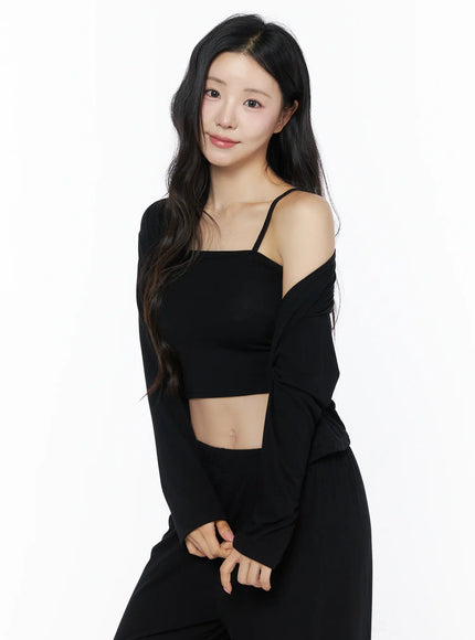 Crop Cami, Cardigan & Sweatpants Set IU525 Black upper-body close-up on model with cardigan slipped off shoulder, revealing square-neck spaghetti-strap crop cami and midriff