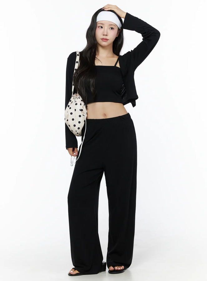 LEWKIN Crop Cami, Cardigan & Sweatpants Set IU525 Black S/M front shot on model standing with hand raised to head, styled with polka dot bucket bag and white headband