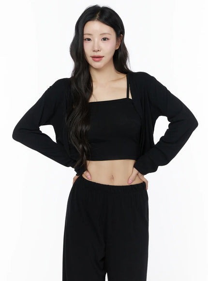 Crop Cami, Cardigan & Sweatpants Set IU525 Black front shot on model hands on hips, cropped open cardigan over square-neck cami, wide-leg sweatpants, straight-on gaze