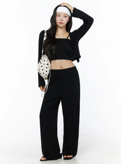 LEWKIN Crop Cami, Cardigan & Sweatpants Set IU525 Black S/M front shot on model standing with hand raised to head, styled with polka dot bucket bag and white headband