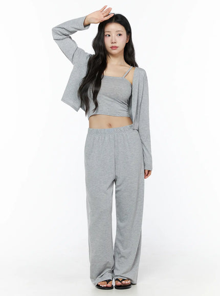 Crop Cami, Cardigan & Sweatpants Set IU525 Gray full front shot on model raising hand to forehead, gray marl open cardigan over matching cami and wide-leg sweatpants, sandals
