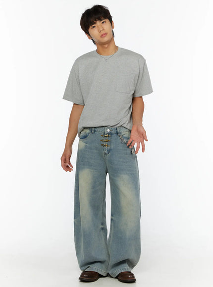 Cross Charm Tag Keychain IL507 Silver styled on male model front view wearing gray tee and wide-leg washed denim jeans with keychain clipped to waistband