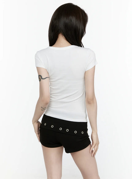 Cross Detail T-Shirt IL522 White back model shot, clean plain back panel, cap sleeves, fitted waist, paired with black grommet shorts