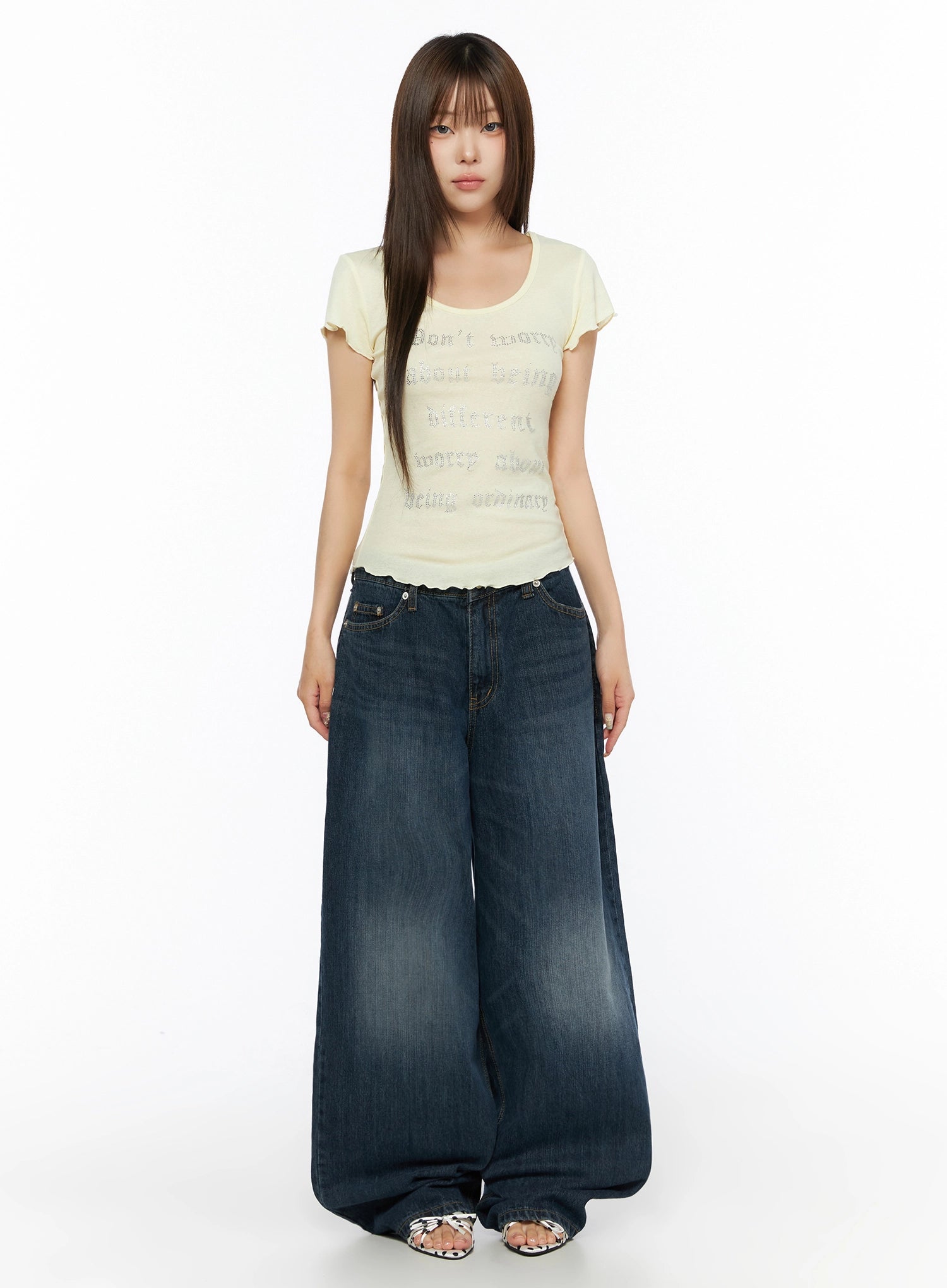 Cruz Wide Leg Jeans IL523 Dark blue full-body front view on model, styled with yellow graphic tee, standing straight, ultra-wide leg hem pooling at floor, sandals