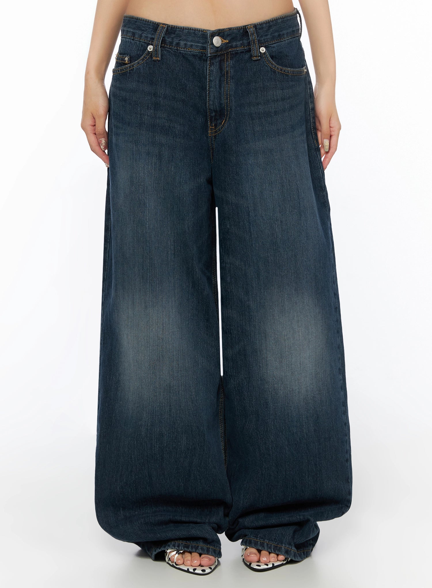 LEWKIN Cruz Wide Leg Jeans IL523 Dark blue front view on model, low-rise waistband with silver button, wide-leg silhouette, washed denim, polka-dot sandals