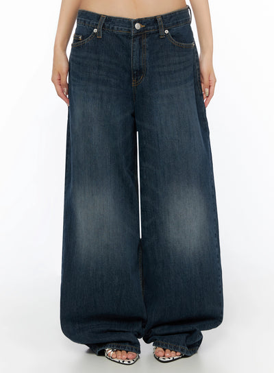 LEWKIN Cruz Wide Leg Jeans IL523 Dark blue front view on model, low-rise waistband with silver button, wide-leg silhouette, washed denim, polka-dot sandals