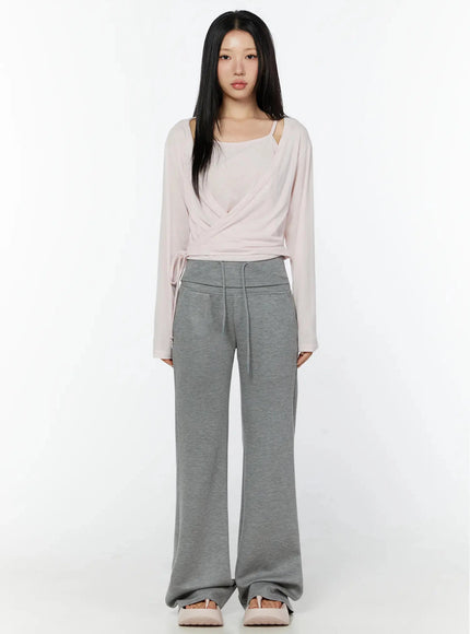 Cuffed Flare Lounge Pants IU524 Gray front full-length shot on model wearing pink wrap top standing upright showing wide-leg flare silhouette
