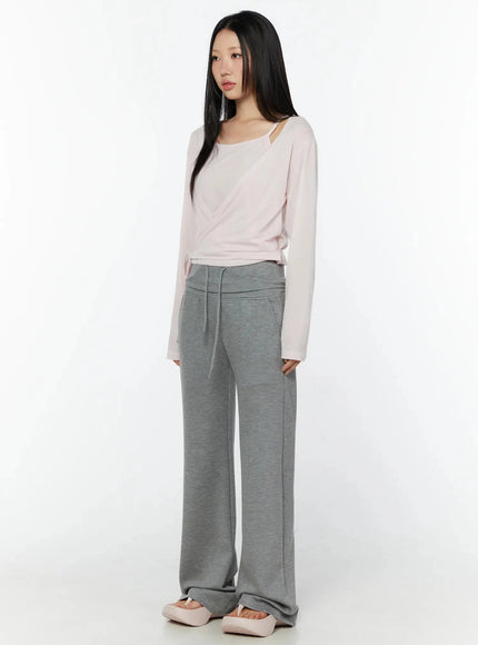 Cuffed Flare Lounge Pants IU524 Gray three-quarter front full-length shot on model in pink wrap top slight angle showing drawstring and pocket detail