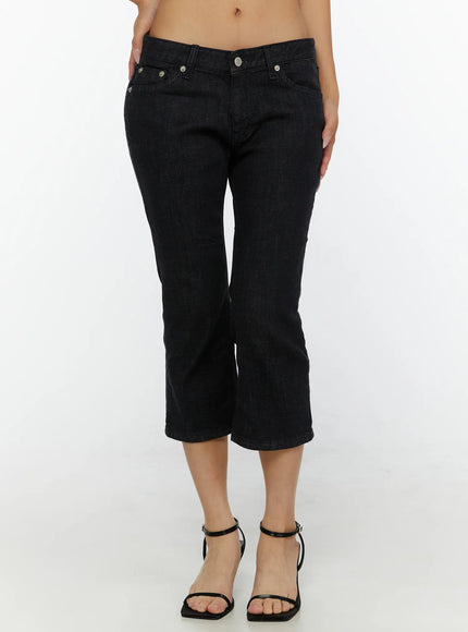 Cyril Low-Rise Capri Jeans CL515 Black front close-up shot on model highlighting low-rise fit five-pocket construction silver rivets and flared capri hem
