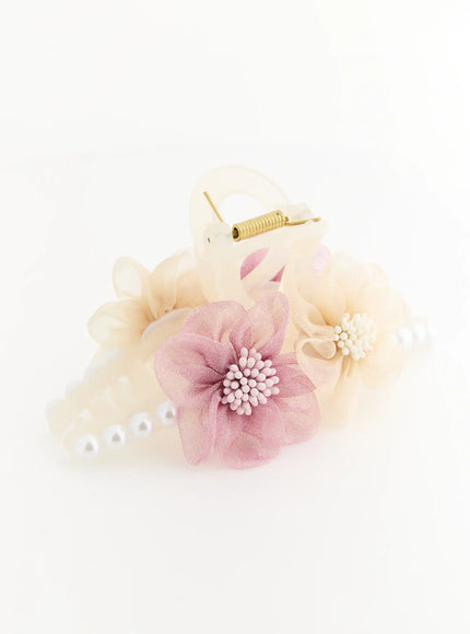 Daisy Hair Clip IL503 ivory side-angle flat lay highlighting pink organza flower center beads and cream floral detail with pearl row