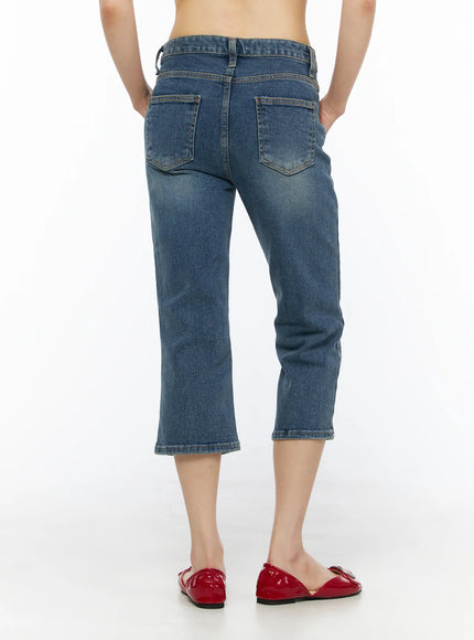Deena Washed Capri Jeans CU530 blue denim back shot on model showing two patch back pockets and cropped hem with subtle fading