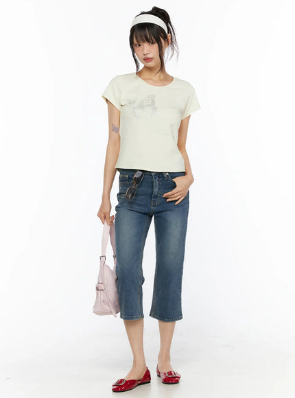 Deena Washed Capri Jeans CU530 blue denim front full-length shot on model standing upright styled with cream butterfly tee and pink bag