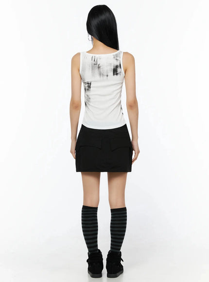 Dirty Wash Chest Pocket Tank Top IL509 White back shot on model showing clean white back panel and abstract print styled with black mini skirt