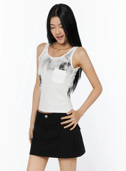 Dirty Wash Chest Pocket Tank Top IL509 White angled front shot on model hand on hip looking down styled with black cargo mini skirt
