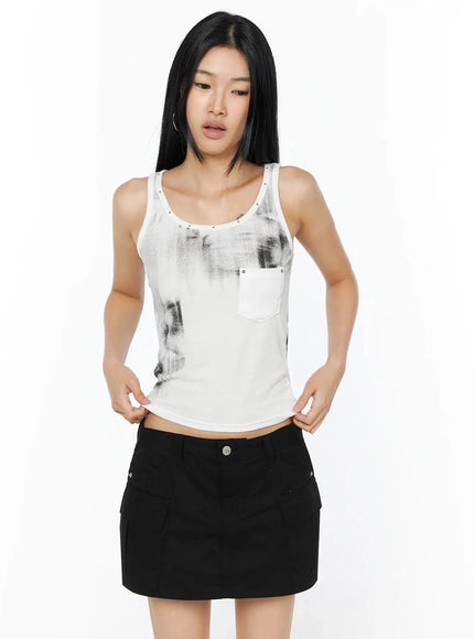 Dirty Wash Chest Pocket Tank Top IL509 White front shot on model looking down hands on waistband showing cropped silhouette and stud detail