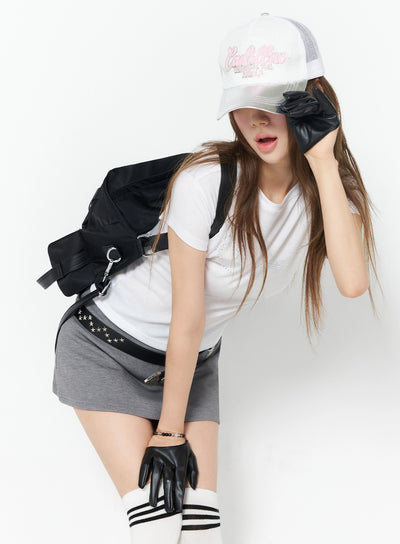 LEWKIN Diva Short Sleeve Tee IU525 White S/M front view on model wearing cap, black leather gloves, gray mini skirt, styled with backpack and knee-high socks