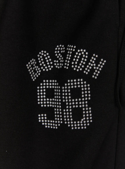 Dot Print Sagging Sweatpants IL515 Black close-up of silver studded rhinestone logo lettering reading BAD SIGN on black cotton fabric