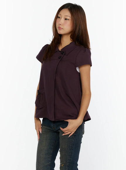 Double-Button Short Sleeve Blouse CL515 dark purple side view model standing showing flared silhouette button-accent pocket and puff cap sleeves