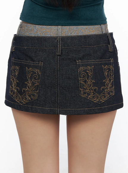 Double-Layered Back Embroidered Denim Mini Skirt CL513 dark indigo close-up back detail showing ornate gold baroque embroidery on both back pockets