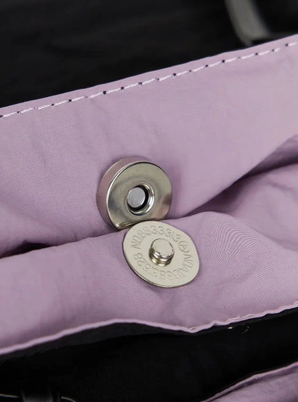 Double Pocket Shoulder Bag IL516 Pink close-up interior detail showing silver magnetic snap closure against pink nylon lining with stitched leather trim
