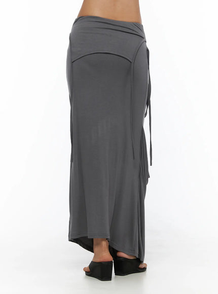 Draped Maxi Skirt CL503 Dark gray back view on model revealing smooth paneled waistband, side ties, and asymmetric draped hem