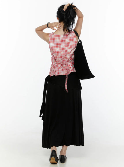 Draped Wrap Maxi Skirt CL520 Black back shot on model wearing red gingham top, showing back tie closure and full pleated maxi hem