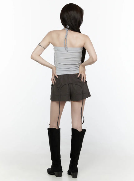 Drawstring Banded Shorts IL522 Dark gray full-body back view on model in gray halter top and black cowboy boots showing back pockets and hanging straps