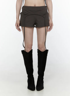 LEWKIN Drawstring Banded Shorts IL522 Dark gray front view on model wearing black knee-high boots, low-rise waistband with curved seam detail and hanging straps