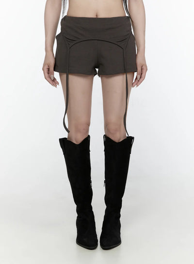 LEWKIN Drawstring Banded Shorts IL522 Dark gray front view on model wearing black knee-high boots, low-rise waistband with curved seam detail and hanging straps
