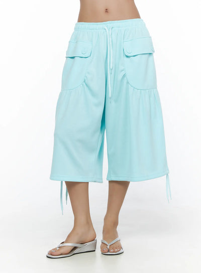 LEWKIN Drawstring Bermuda Shorts CL513 Mint S/M front shot on model wearing silver wedge flip-flops, elastic waistband with white drawstring, flap cargo pockets
