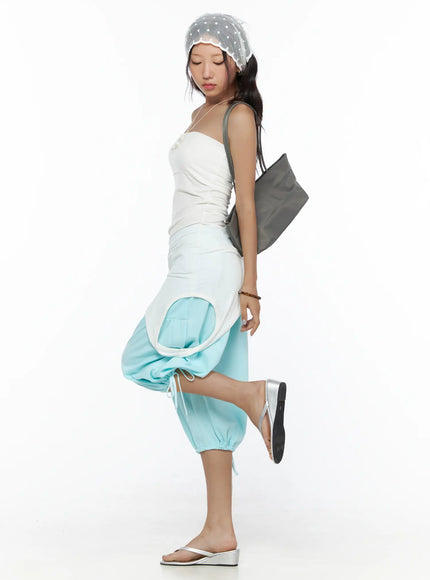 Drawstring Bermuda Shorts CL513 Mint side full outfit shot on model styled with white tube top, polka-dot head scarf, gray bag, showing gathered balloon-leg and ruched hem