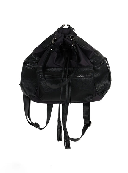 Drawstring Pocket Bucket Bag IL515 Black back product shot showing nylon drawstring bucket top, adjustable backpack straps, tassel detail, and pebbled leather side panels