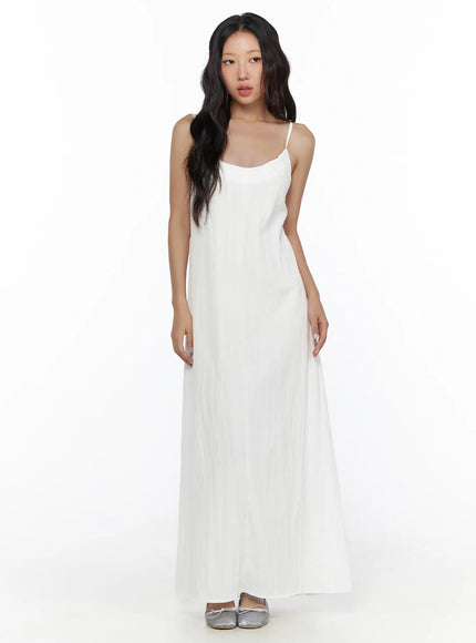 Drawstring Sleeveless Long Dress CL510 White front shot on model standing upright showing scoop neckline thin straps and flowy maxi silhouette