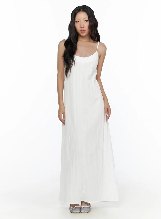 Drawstring Sleeveless Long Dress CL510 White front shot on model standing upright showing scoop neckline thin straps and flowy maxi silhouette