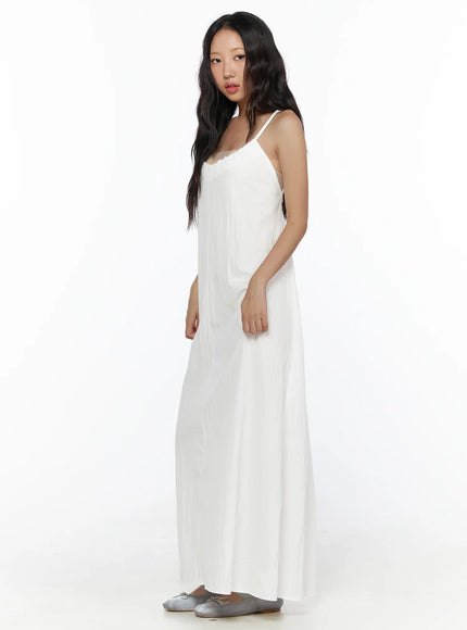 Drawstring Sleeveless Long Dress CL510 White side shot on model showing relaxed A-line drape thin spaghetti straps and lightweight crinkle fabric