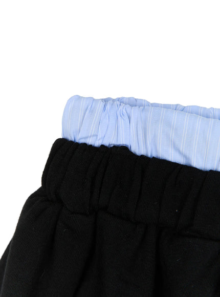 Drawstring Sweat Shorts CL527 Black close-up detail shot showing layered waistband with light blue striped elastic lining over black elastic, double-waist construction