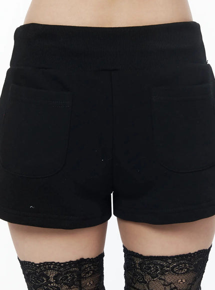 Drawstring Sweat Shorts IL502 Black close-up back detail showing two patch pockets, ribbed elastic waistband and fleecy cotton fabric texture