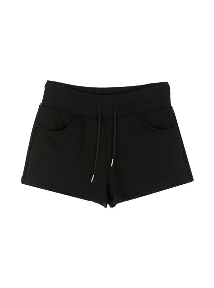 Drawstring Sweat Shorts IL502 Black flat-lay front view showing ribbed elastic waistband, drawstring with silver tips and two side patch pockets