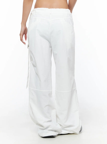 Drawstring Wide Leg Parachute Pants CU524 White back view on model showing clean wide leg cut panel seams and side strap detail with sneakers