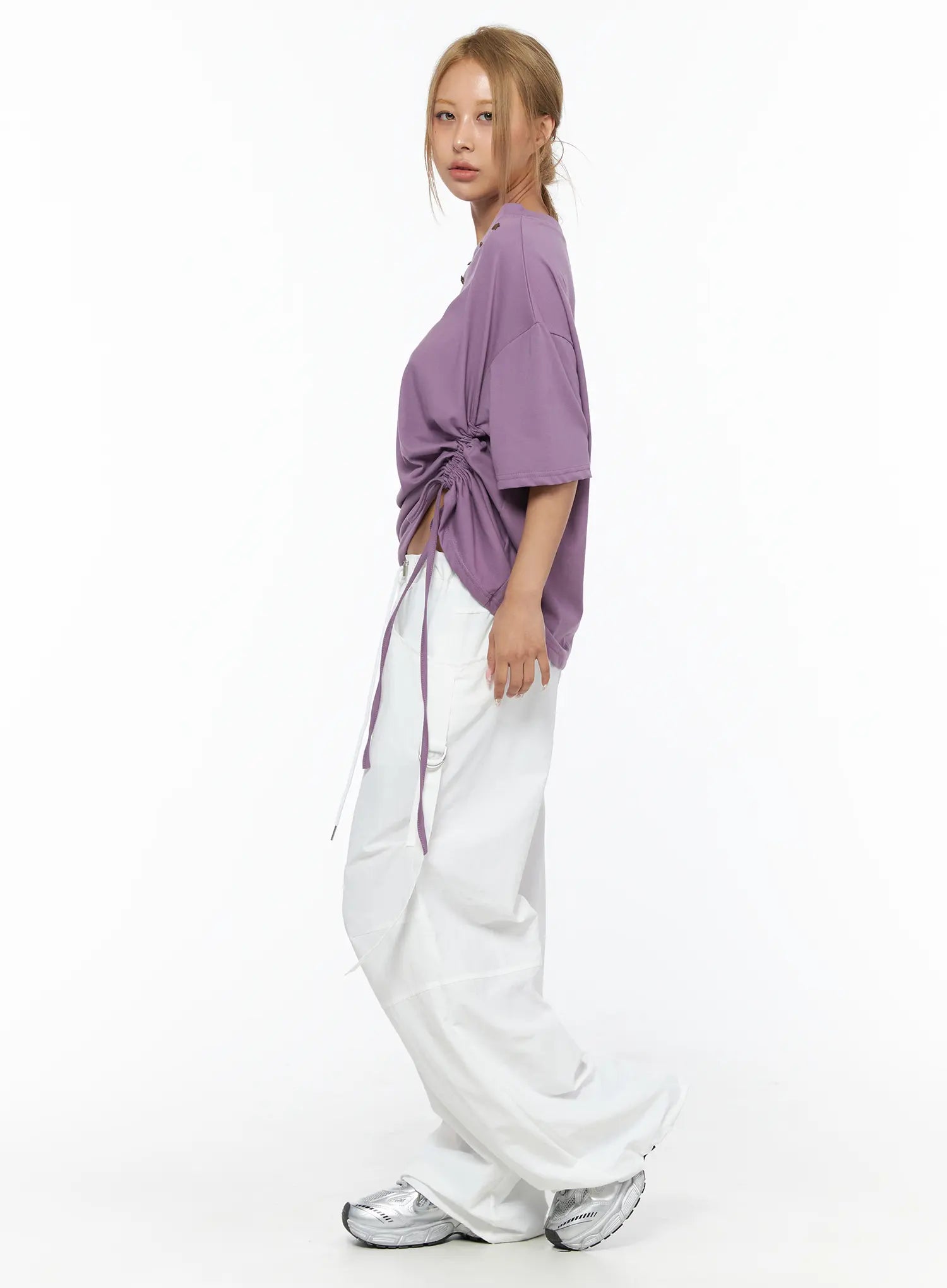 Drawstring Wide Leg Parachute Pants CU524 White full-body side styling shot on model in purple top showing wide leg silhouette and strap detail with sneakers