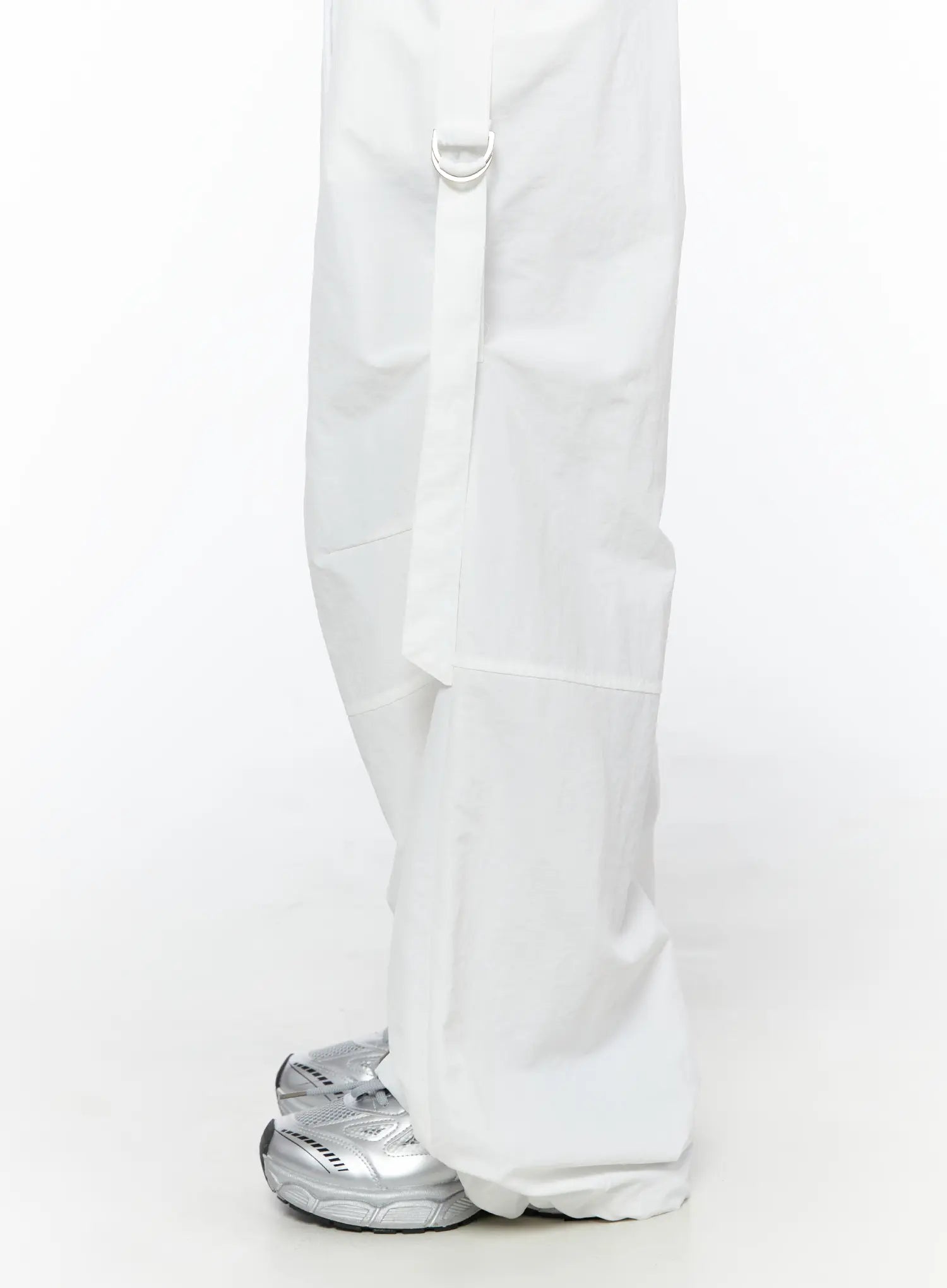 Drawstring Wide Leg Parachute Pants CU524 White close-up side detail of D-ring strap panel seam and wide leg hem pooling over silver sneakers
